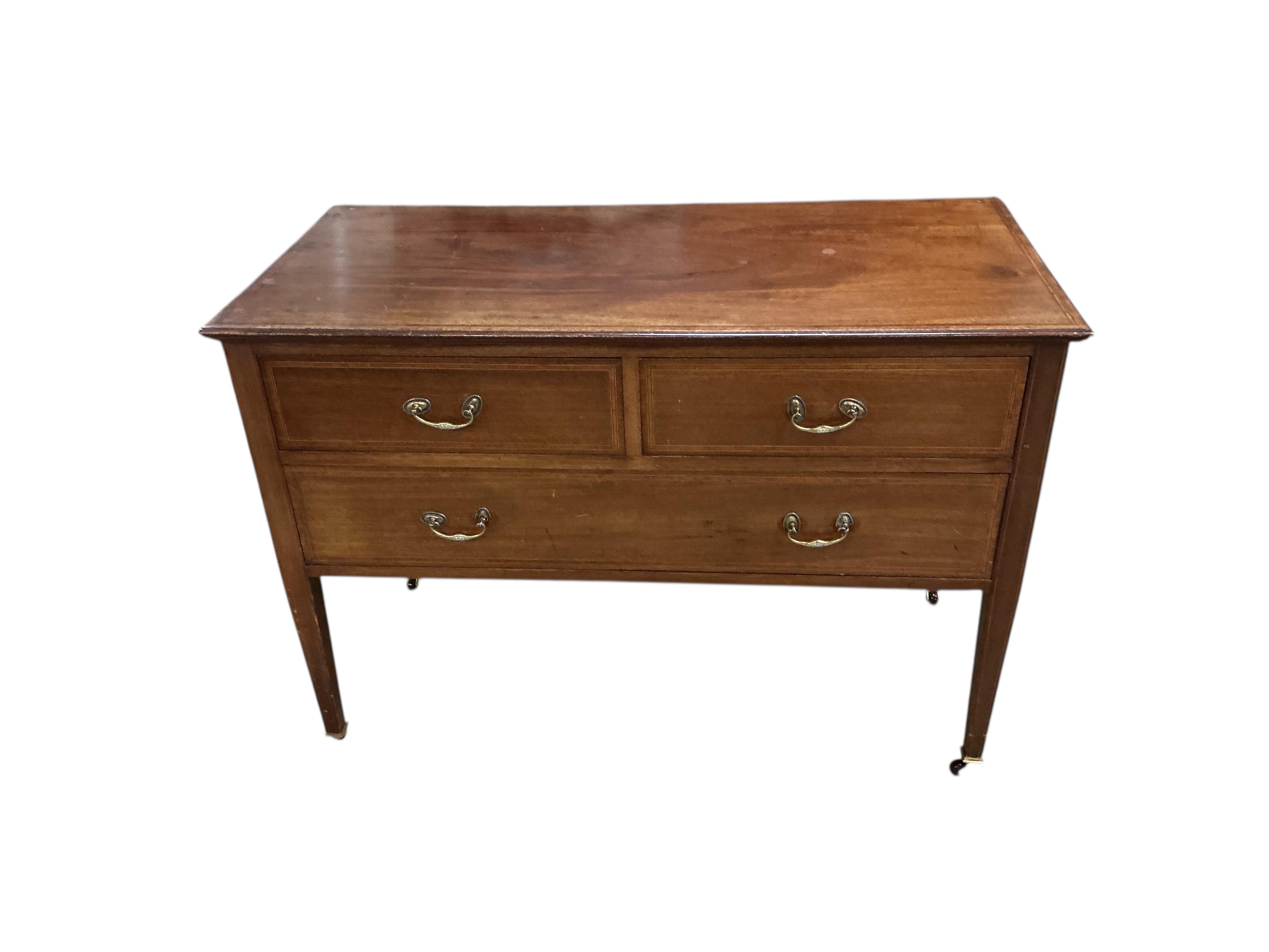 A near pair of Edwardian banded mahogany chests, each fitted with one long and two short drawers, width 107cm, depth 48cm, height 78cm